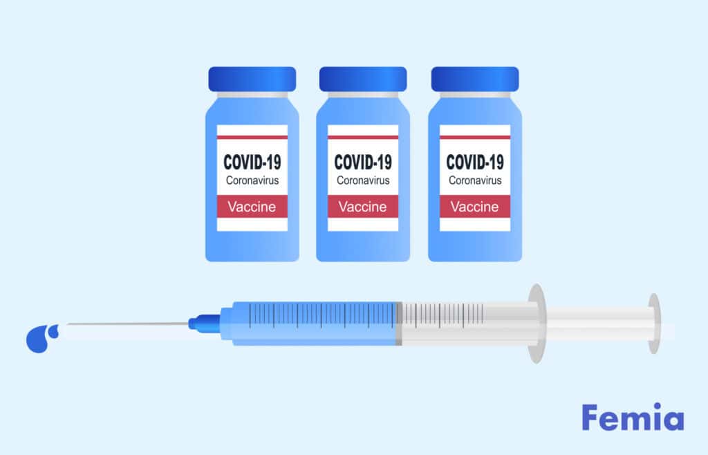 Vials labeled 'COVID-19 Coronavirus Vaccine' and a syringe, representing Pfizer's COVID-19 vaccine.