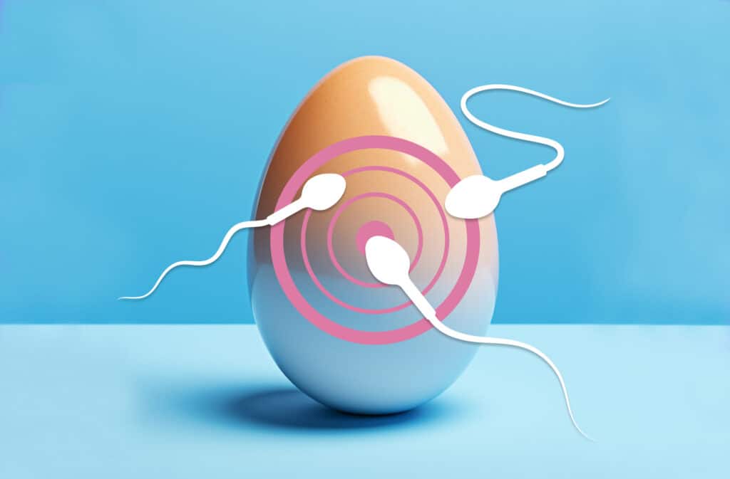 An illustration of an egg covered with spermatozoids representing good egg quality.