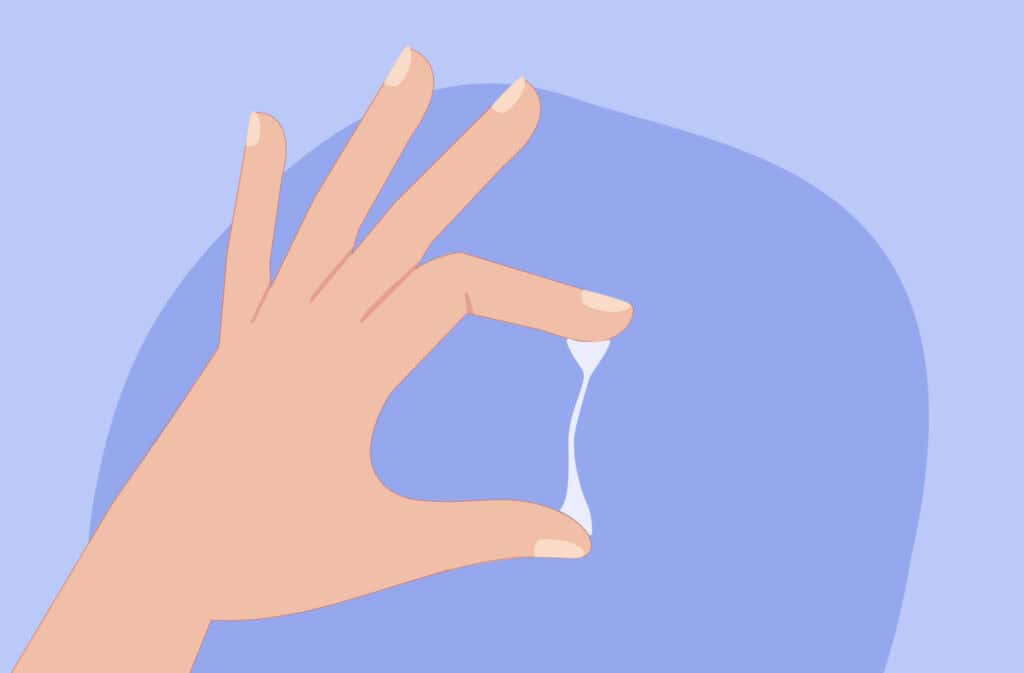 An illustration of a hand with a egg white discharge stretched between fingers.