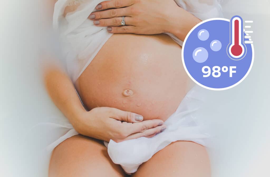 A photo of a pregnant woman taking a bath representing are baths safe while pregnant.