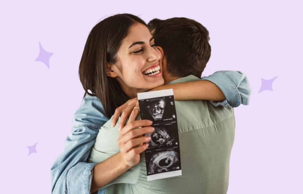 A photo with a hugging couple holding a sonogram picture, representing pregnancy after miscarriage