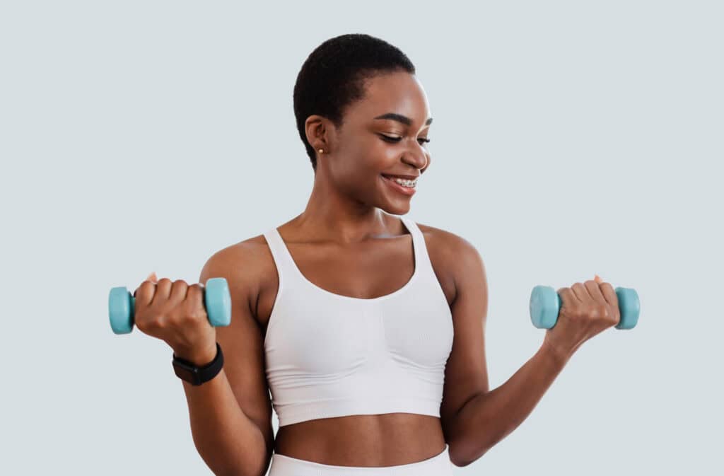 A photo of a beautiful black woman during a workout and having a coregasm.