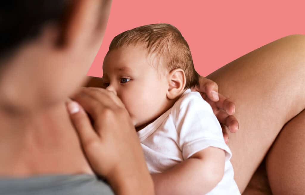 A photo of a woman feeding a newborn and wondering 'how much breastmilk a newborn should eat'.