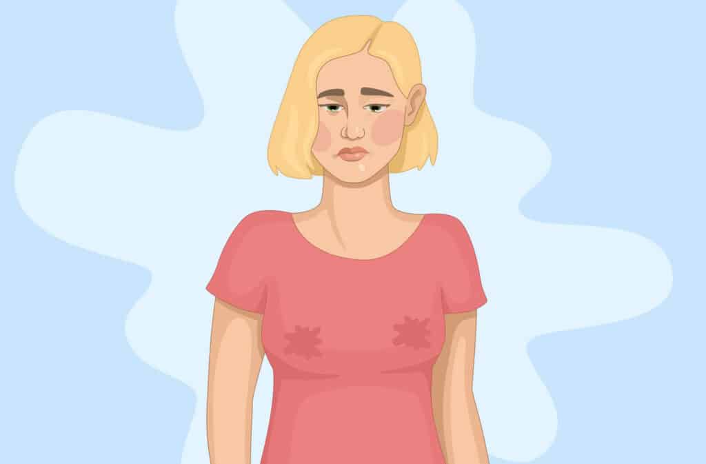 An illustration of a young woman wondering 'How to lower prolactin to increase fertility?', because upset with wet marks on her breasts because of hyperprolactinemia.