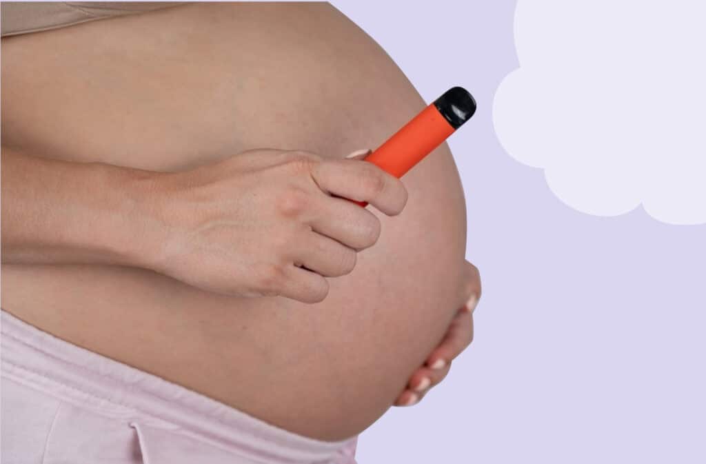 A photo of a woman vaping while pregnant.