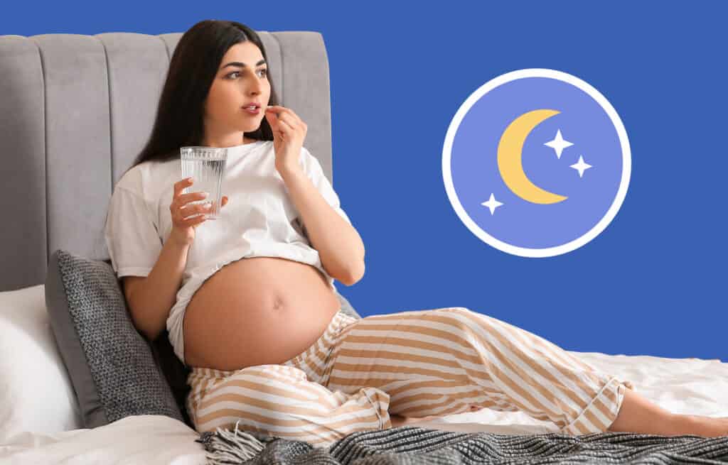 A photo of a pregnant woman on a bed holding a glass of water and a pill, and wondering 'Can you take melatonin while pregnant?'