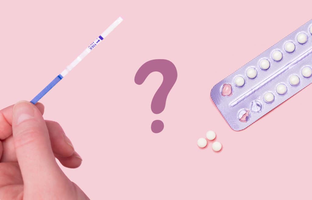 A photo of a hand holding the ovulation test and contraception pills aside, representing the question, 'Do you still ovulate on birth control?'